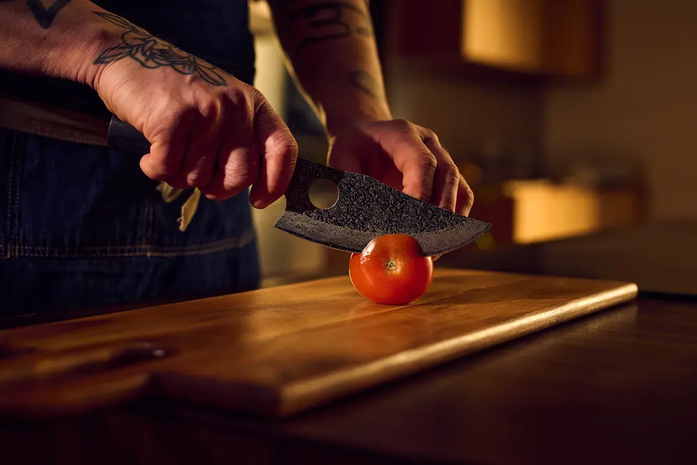 Chopping vegetables with the hand-forged knife